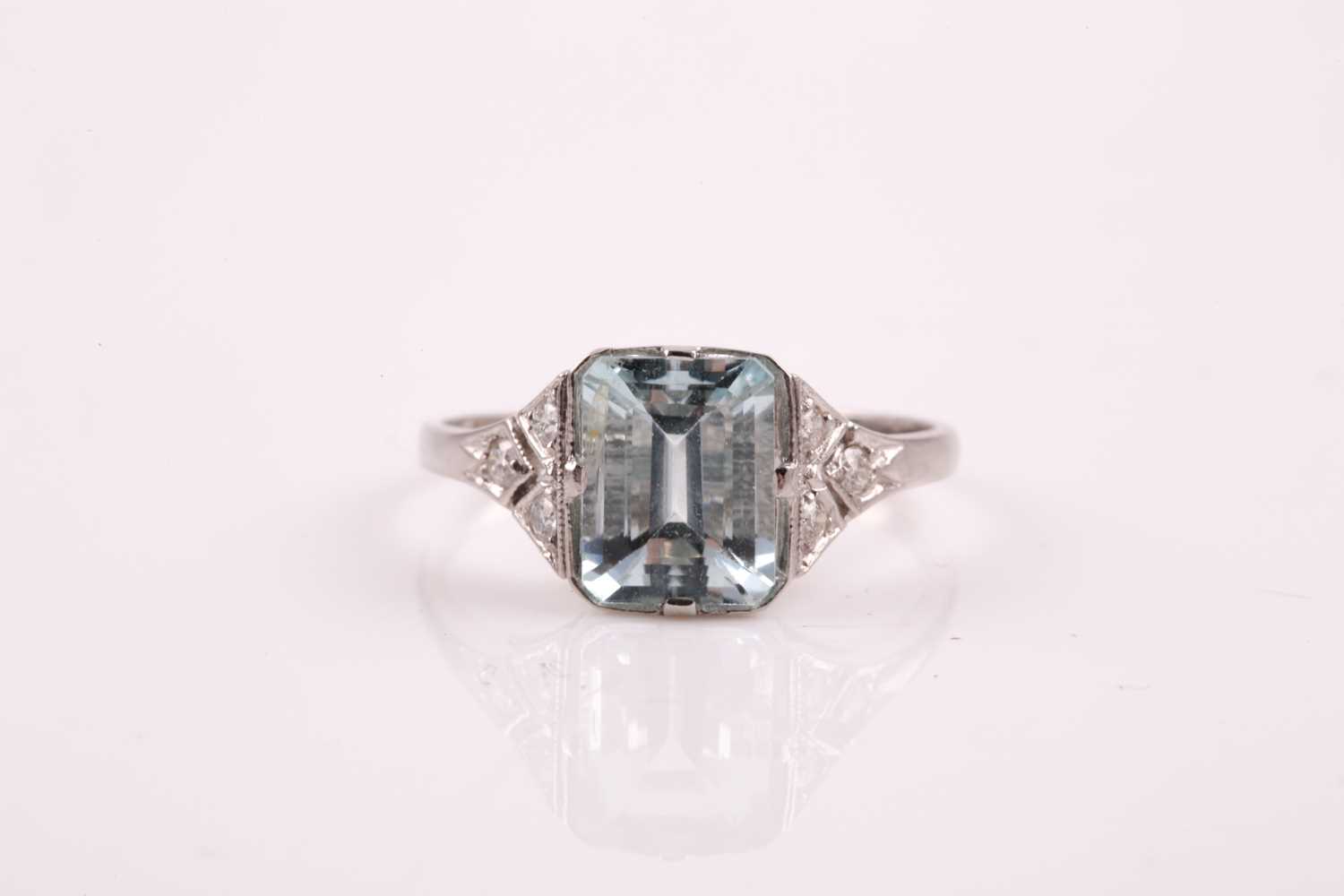 Lot 297 - A platinum, diamond, and aquamarine ring, set...