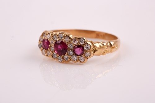 Lot 88 - An 18ct yellow gold, diamond, and ruby ring,...