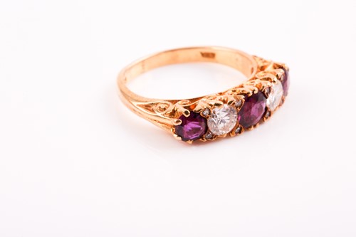 Lot 227 - A five stone half hoop ruby and diamond ring;...