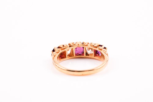 Lot 227 - A five stone half hoop ruby and diamond ring;...