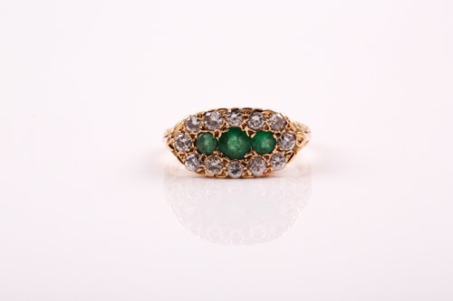 Lot 244 - An emerald and diamond half hoop ring; the...