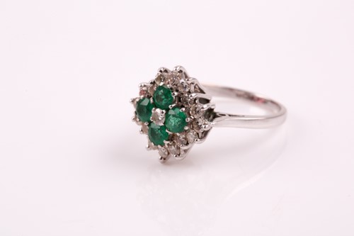 Lot 259 - An emerald and diamond cluster ring; the five...