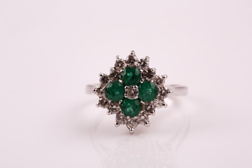 Lot 259 - An emerald and diamond cluster ring; the five...