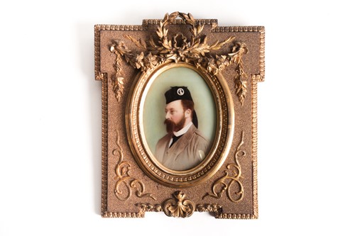 Lot 486 - A 19th century reverse-painted oval portrait...