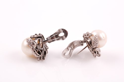 Lot 63 - A pair of diamond and pearl cluster earrings,...