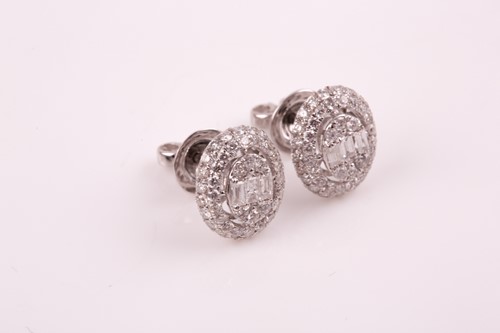 Lot 104 - A pair of white gold and diamond oval cluster...