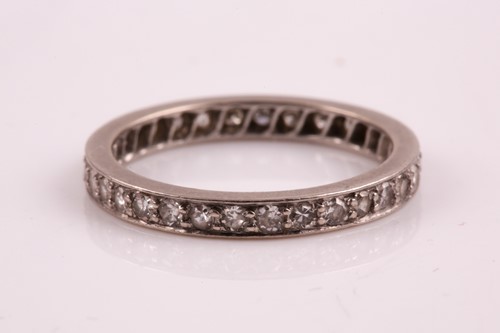 Lot 77 - A diamond eternity ring, set with round-cut...
