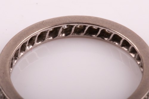 Lot 77 - A diamond eternity ring, set with round-cut...