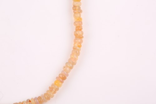 Lot 241 - An opal beaded necklace, comprising of smooth...