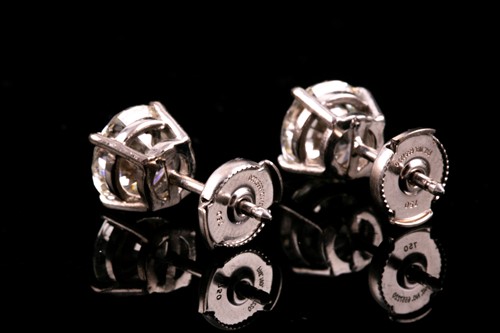 Lot 180 - A pair of round brilliant-cut diamond earrings,...