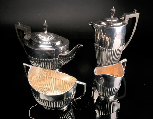 Lot 486 - A matched four piece silver tea set, William...