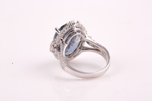 Lot 256 - A 14ct white gold, diamond, and sapphire ring,...