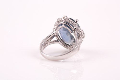 Lot 256 - A 14ct white gold, diamond, and sapphire ring,...