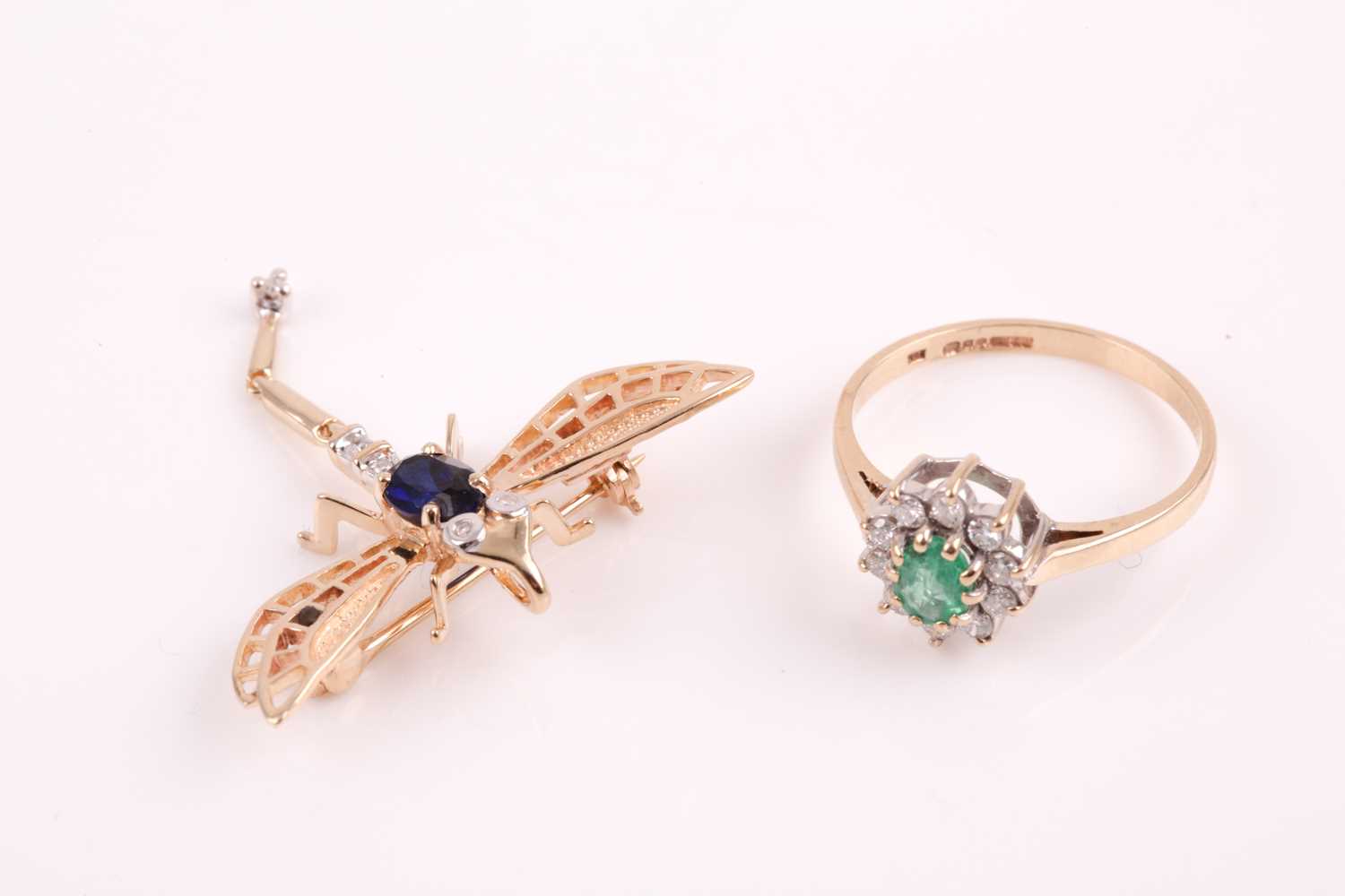 Lot 328 - A 9ct yellow gold, diamond, and emerald...