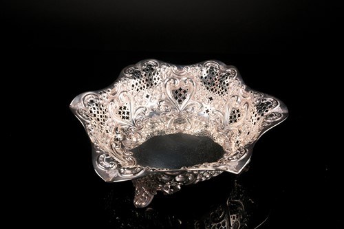 Lot 447 - A late Victorian pierced and embossed bread...