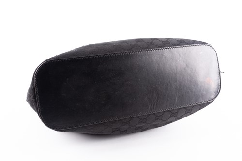 Lot 418 - A Gucci black leather and canvas handbag, a...