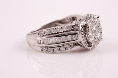 Lot 69 - A 14ct white gold and diamond cluster ring,...