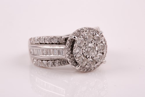 Lot 69 - A 14ct white gold and diamond cluster ring,...
