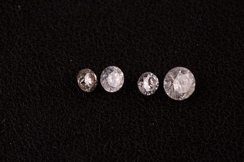Lot 58 - A group of four round brilliant-cut loose...