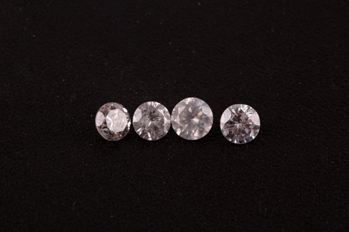 Lot 173 - A group of four loose round brilliant-cut...