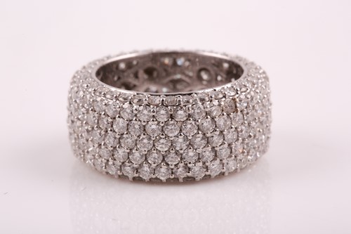 Lot 50 - An 18ct white gold and diamond eternity band...