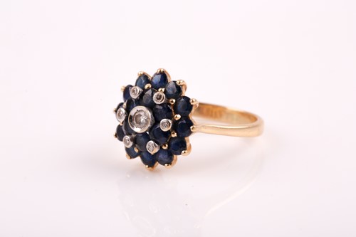 Lot 99 - A yellow metal, diamond, and sapphire roundel...