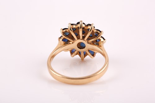 Lot 99 - A yellow metal, diamond, and sapphire roundel...