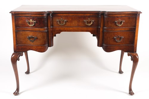 Lot 221 - An early 20th century desk, having a well...