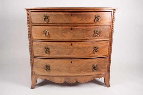 Lot 223 - A Regency Scottish mahogany bow fronted chest...