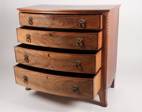 Lot 223 - A Regency Scottish mahogany bow fronted chest...