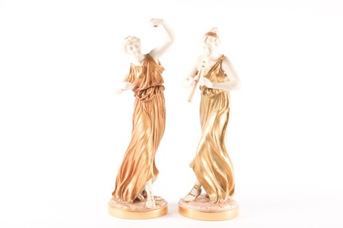 Lot 361 - A pair of Royal Worcester blush ivory figures...