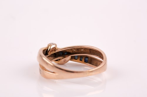 Lot 29 - A 9ct yellow gold, sapphire and diamond accent...