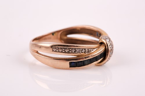 Lot 29 - A 9ct yellow gold, sapphire and diamond accent...