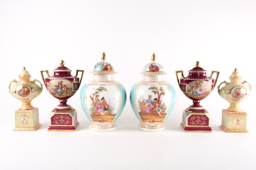 Lot 365 - A pair of Vienna style vases and covers, with...