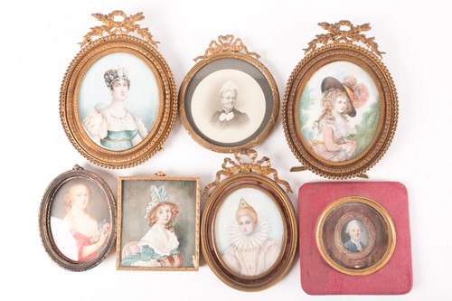 Lot 408 - A group of five portrait miniatures on ivory,...