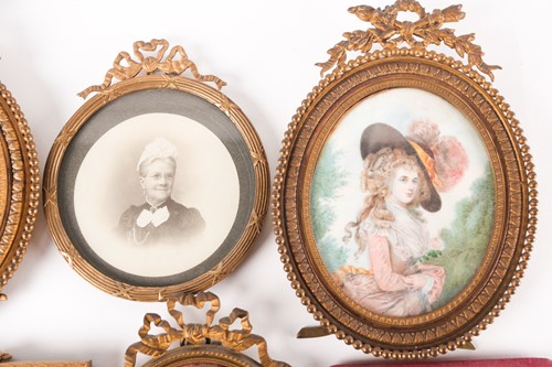 Lot 408 - A group of five portrait miniatures on ivory,...