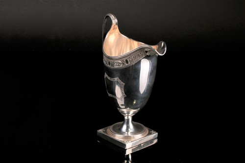 Lot 490 - A George III silver helmet shaped cream jug,...