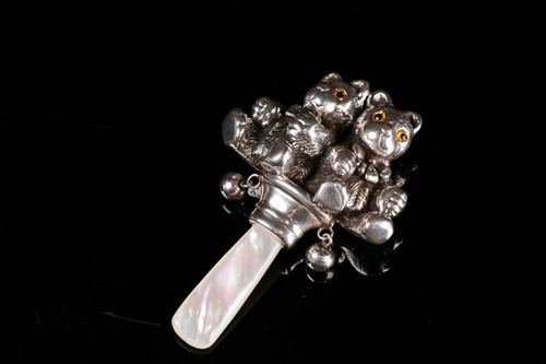 Lot 468 - A novelty white metal children's teething...