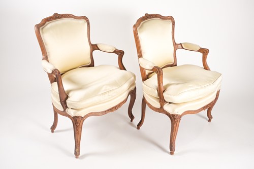 Lot 231 - A pair of French Louis XV carved beechwood...