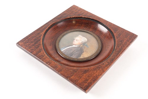 Lot 410 - A wood-framed portrait miniature of a young...