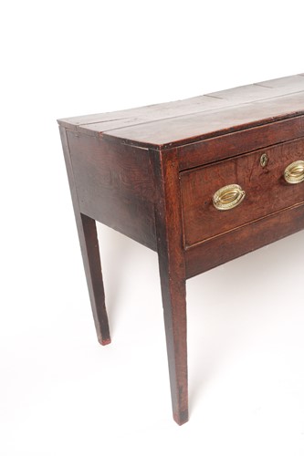 Lot 257 - A George III oak three drawer dresser base...
