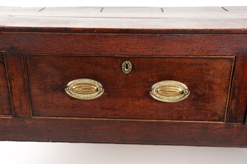 Lot 257 - A George III oak three drawer dresser base...