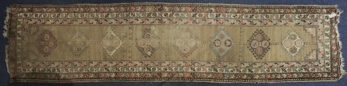 Lot 322 - An old northwest Persian runner with multiple...