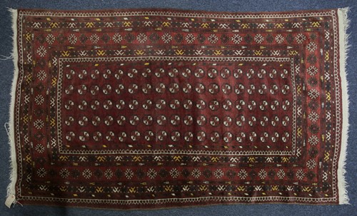 Lot 228 - A 20th century Turkomen rug with a lattice of...
