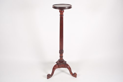 Lot 277 - A George III style stained wood torchere with...