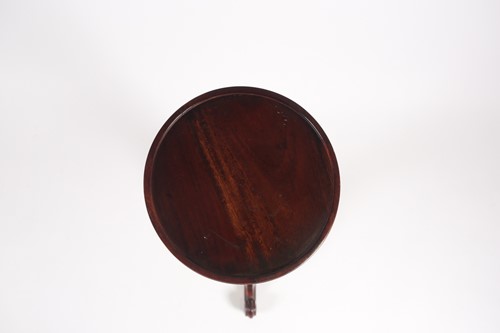 Lot 277 - A George III style stained wood torchere with...