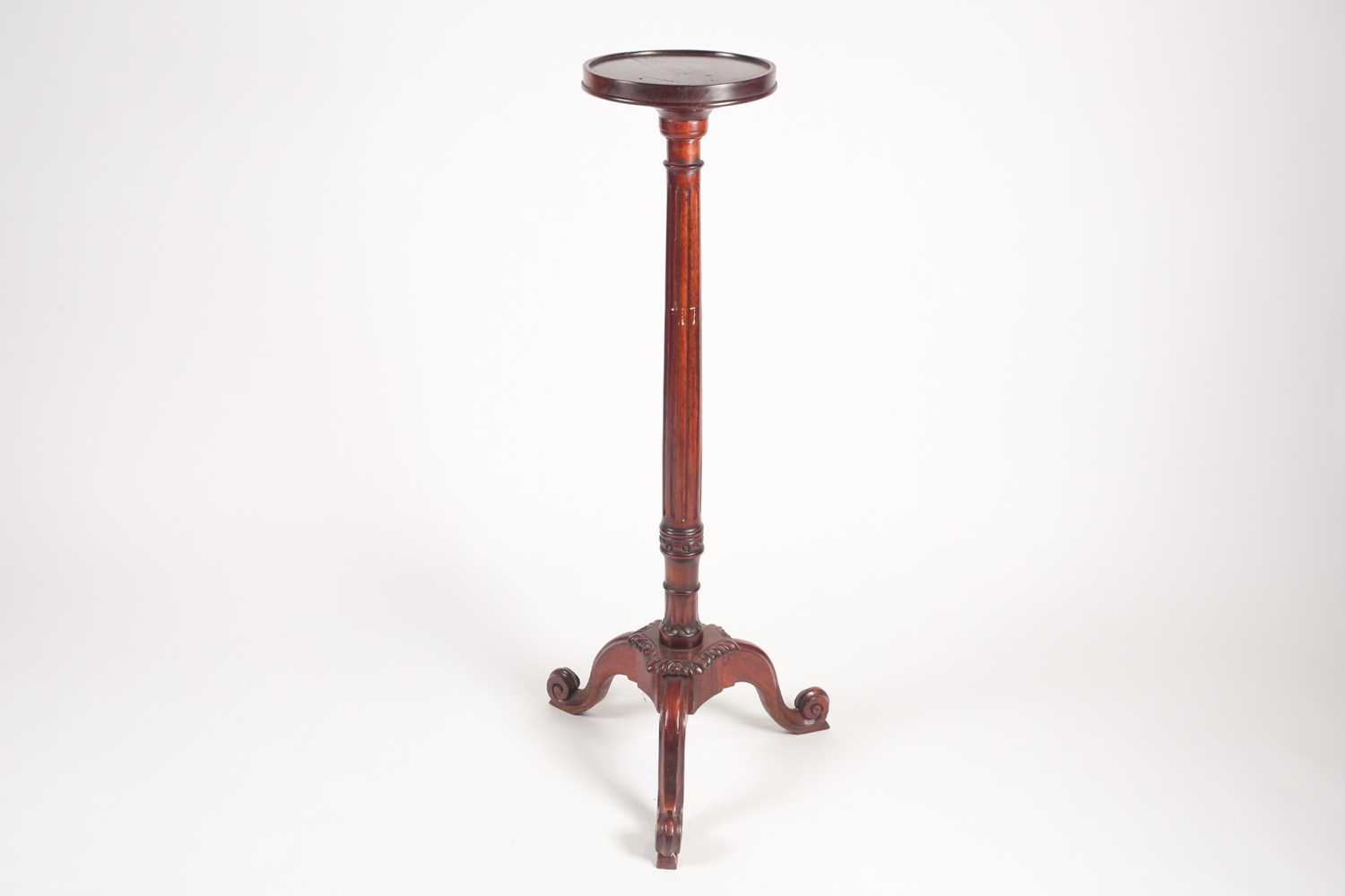 Lot 277 - A George III style stained wood torchere with...