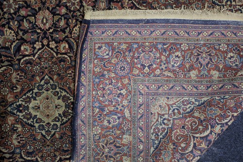 Lot 313 - A 20th century Kashan rug with a flower-filled...