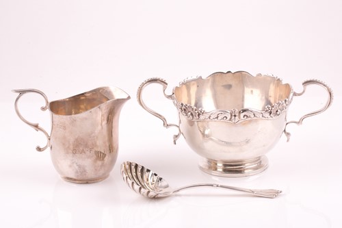 Lot 536 - A silver sugar bowl the rim cast with shells...