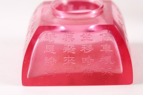 Lot 10 - A Chinese, Peking rose pink carved glass,...